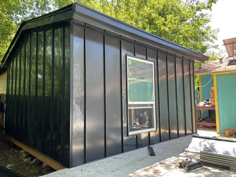 Black standing seam metal wall panels for Roof Inspection in Athens